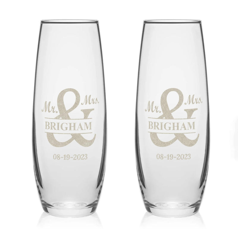 Two clear glasses with 'Mr. & Mrs. Brigham' engraving on a white background