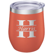 Orange tumbler with 'Harris' logo on a white background