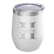White tumbler with 'Harris' engraving on a white background