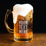 Glass mug of beer with foam on a wooden surface and black background