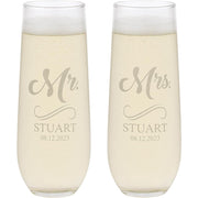 Two champagne flutes with 'Mr. Stuart' and 'Mrs. Stuart' engraving on a white background.