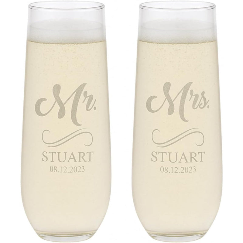 Two champagne flutes with 'Mr. Stuart' and 'Mrs. Stuart' engraving on a white background.