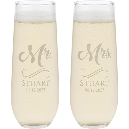 Two champagne flutes with 'Mr. Stuart' and 'Mrs. Stuart' engraving on a white background.