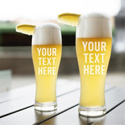 Two glasses of beer with 'Your Text Here' text on a blurred background