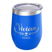Blue insulated tumbler with 'Vivian' and a date engraved on it, against a white background