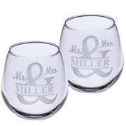 Two clear wine glasses with 'Mr. & Mrs. Miller' engraving on a white background