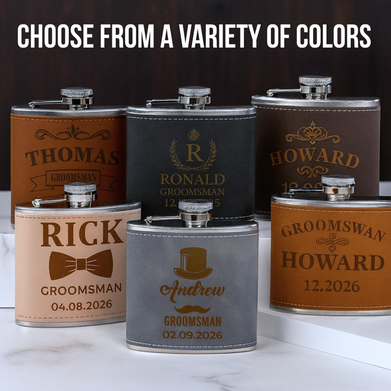 Set of personalized flasks with various designs and text on a marble surface.