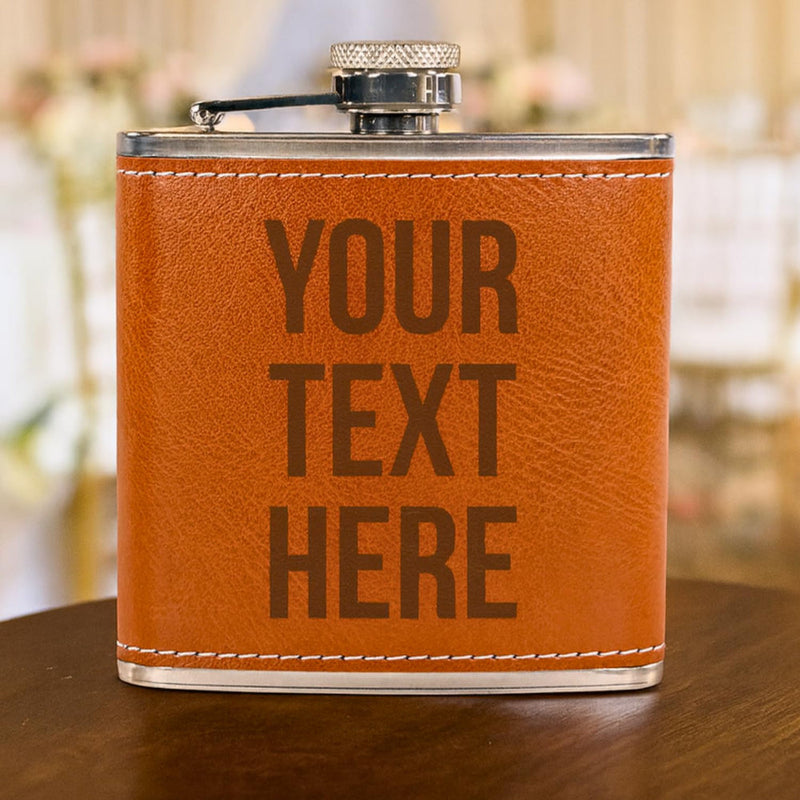 Ornage leather flask with 'Your Text Here' text on a wooden surface.