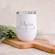 White tumbler with 'Myra' engraving on a wooden board with lavender flowers