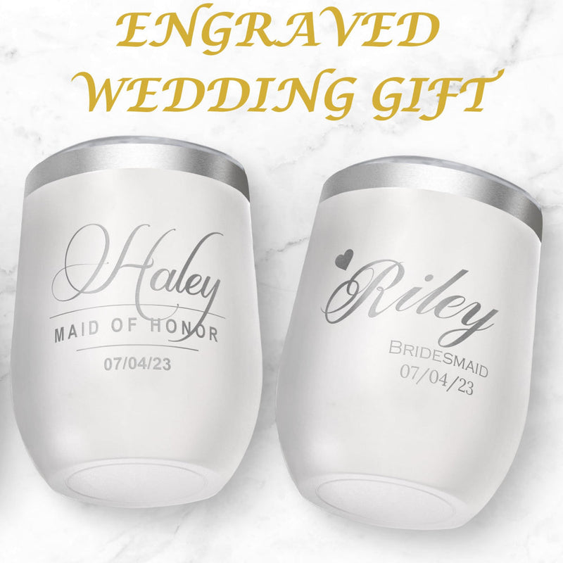 Two white wine tumblers with engraved names and dates on a light background
