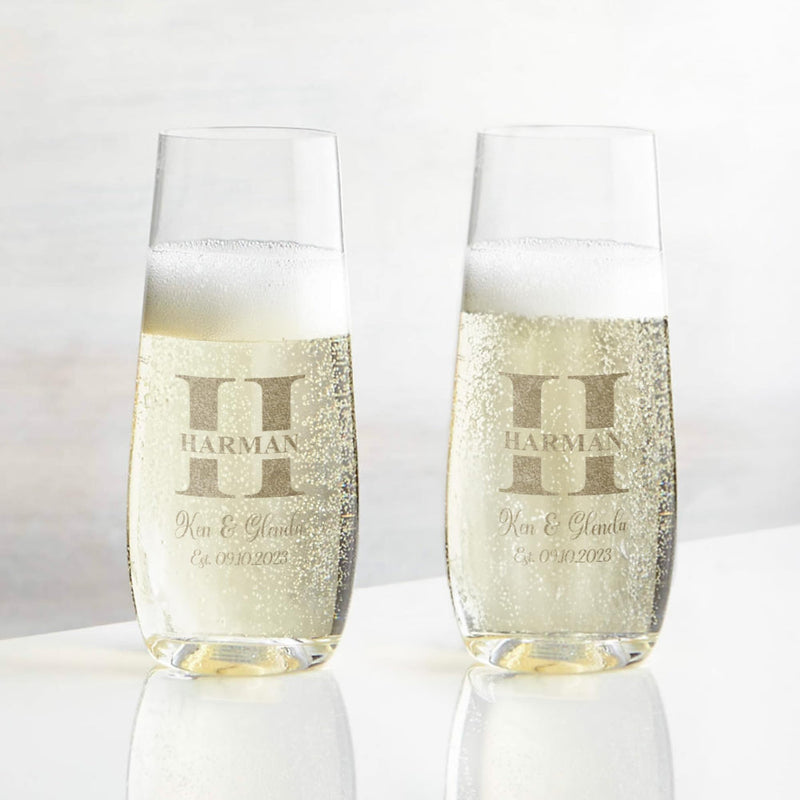 Two champagne flutes with 'Harman' branding on a white background