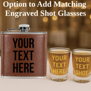 Brown leather flask with 'Your Text Here' text, two shot glasses with customizable text, and option to add engraved shot glasses.
