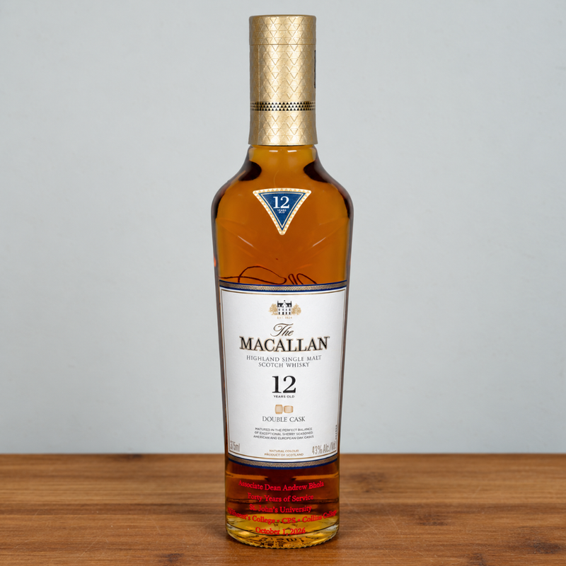 A bottle of The Macallan 12 Year Old Highland Single Malt Scotch Whisky, standing on a wooden surface against a light gray background.
