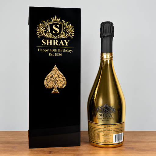 custom engraved gold painted ace of spades box next to an engraved ace of spaced champagne bottle 