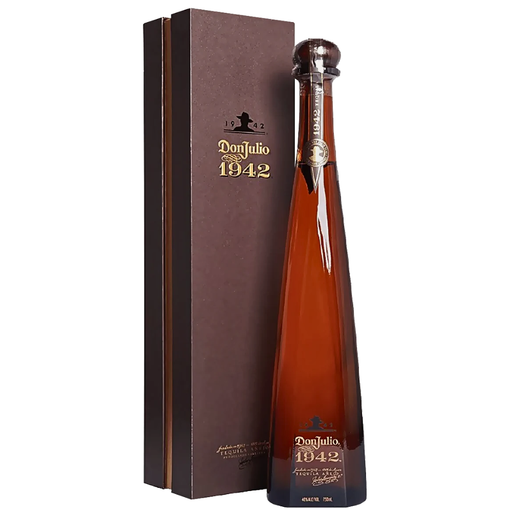 Bottle of Don Julio 1942 tequila with a matching box on a white background