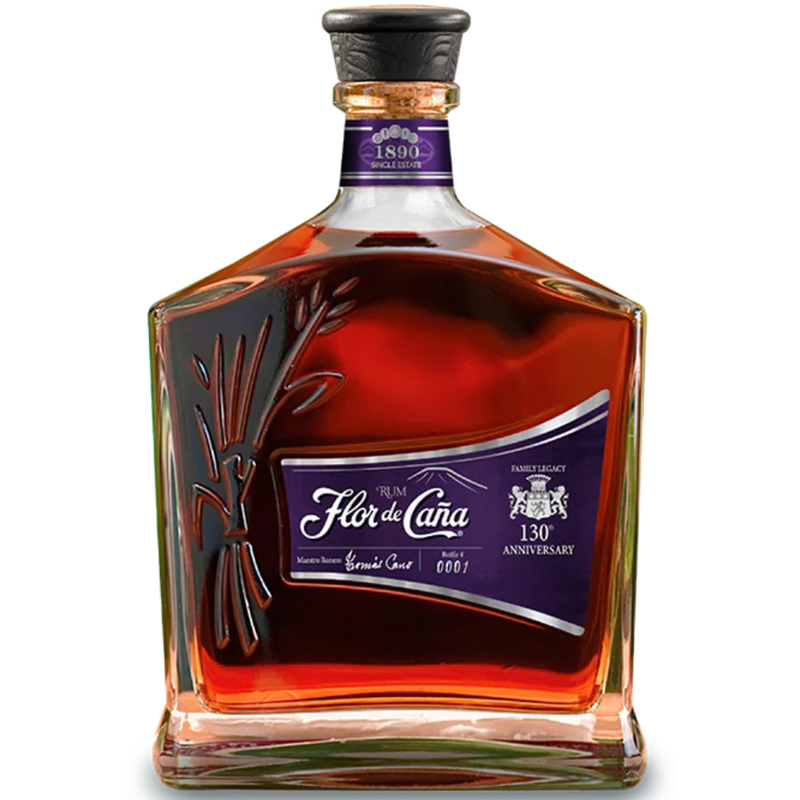 Bottle of Flor de Cana 130 anniversary 20 year aged rum on a white background