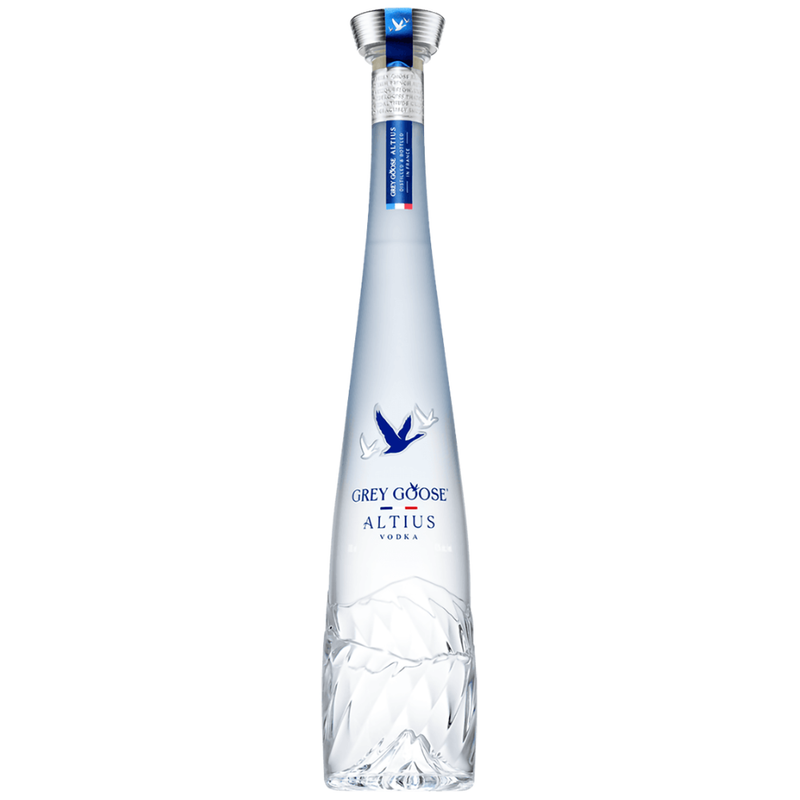 Clear bottle of Grey Goose Altius vodka on a white background
