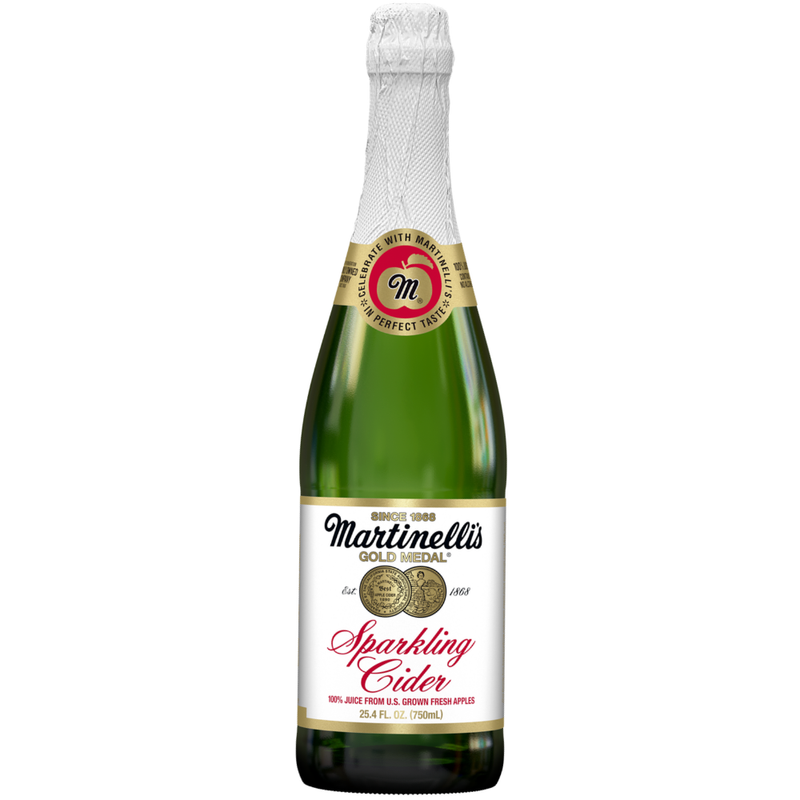 Green bottle of Martinelli's Sparkling Cider on a white background