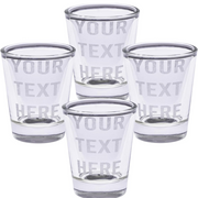 Set of four clear shot glasses with 'Your Text Here' text on a white background